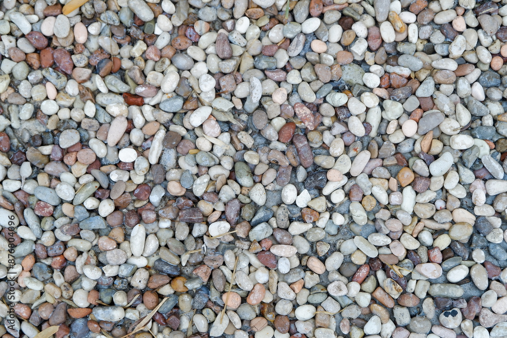Stone pebbles texture or stone pebbles background. stone gravel for interior exterior decoration and industrial construction concept design. a naturally occurring stone pebble motif. Stone pebbles texture or stone pebbles background. stone gravel for interior exterior decoration and industrial construction concept design. a naturally occurring stone pebble motif.