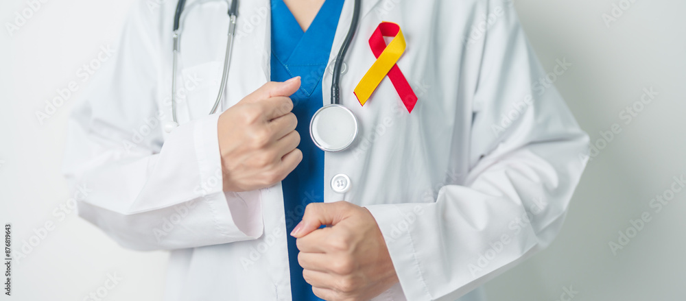 World hepatitis day awareness month, 28 July. Doctor holding Red and Yellow ribbon. Liver cancer, Jaundice, Cirrhosis, Failure, Enlarged, Hepatic Encephalopathy and Health concept World hepatitis day awareness month, 28 July. Doctor holding Red and Yellow ribbon. Liver cancer, Jaundice, Cirrhosis, Failure, Enlarged, Hepatic Encephalopathy and Health concept