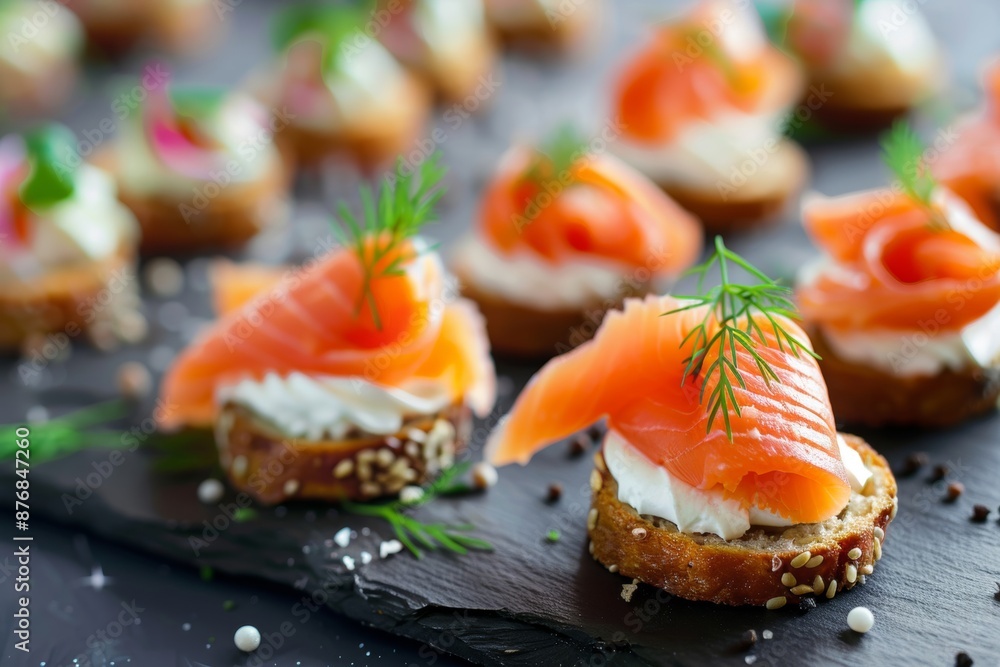 Enjoy delicious canapés featuring smoked salmon delicately paired with cream cheese. These elegant hors d'oeuvres are a sophisticated addition to any event or gathering. Enjoy delicious canapés featuring smoked salmon delicately paired with cream cheese. These elegant hors d'oeuvres are a sophisticated addition to any event or gathering.