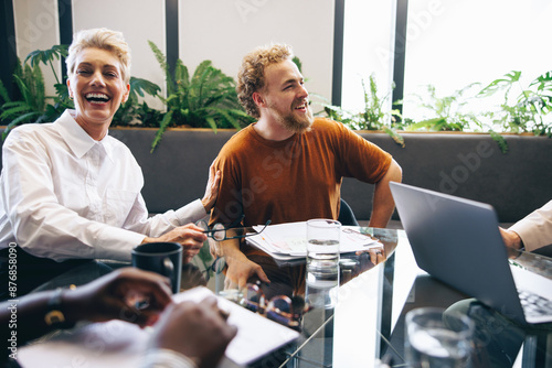Happy business colleagues engaging in a successful meeting
