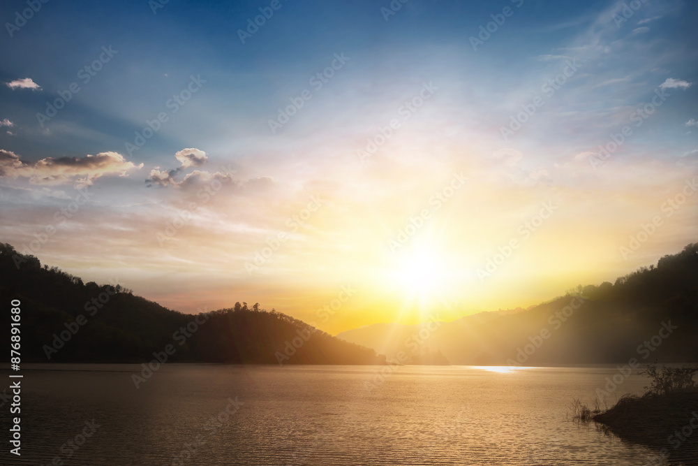 Scenic view of beautiful sunset or sunrise above the pond or lake at spring or early summer evening with cloudy sky background Scenic view of beautiful sunset or sunrise above the pond or lake at spring or early summer evening with cloudy sky background