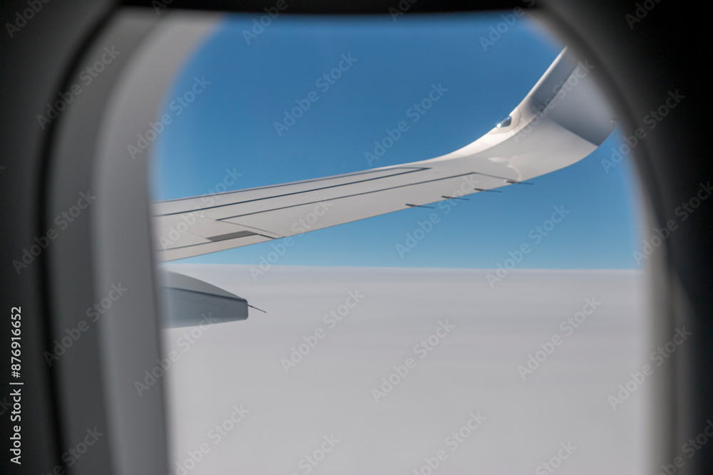 Clouds and sky as seen through window of an aircraft. Clouds and sky as seen through window of an aircraft.