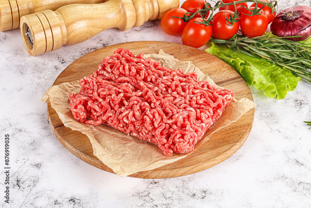 Raw minced beef meat on cutting board Raw minced beef meat on cutting board
