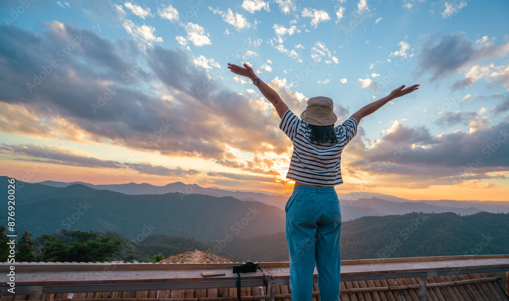 Woman spreading hands with joy and inspiration at sunset. Woman spreading hands with joy and inspiration at sunset.