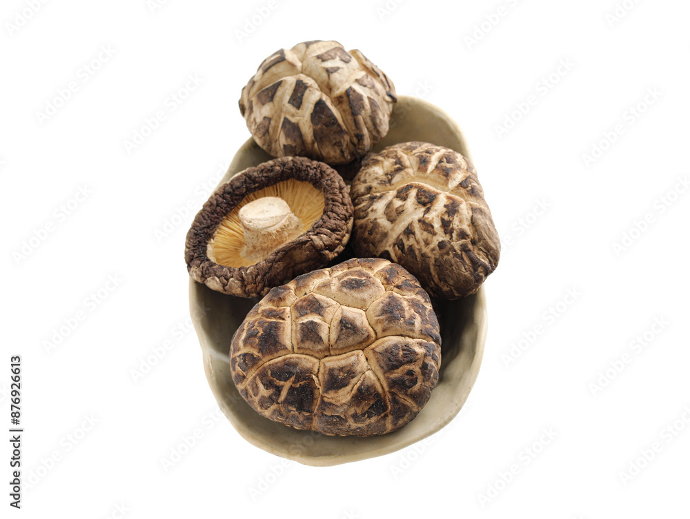 A pile of shiitake mushrooms on a white background A pile of shiitake mushrooms on a white background
