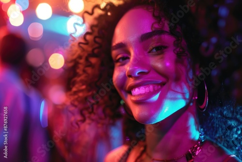 Close up of happy young woman at nightclub
