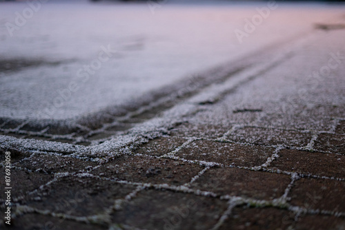 Photography Snow dusting on cobblestones in Northern Ireland, closeup shot