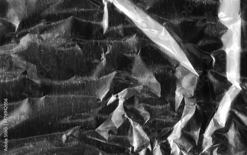 Abstract transparent plastic wrap wrinkled texture on black background. Vector illustration vinyl, texture overlay effect of an old cover with defects and scuffs. Wrinkled, torn and old packaging.