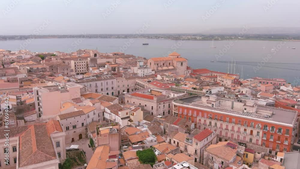 Syracuse, Italy: Aerial view of famous city on Sicily island, summer day with clear blue sky - landscape panorama of Europe from above
Syracuse, Italy: Aerial view of famous city on Sicily island, summer day with clear blue sky - landscape panorama of Europe from above