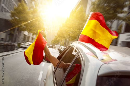 Fans with Spanish Flag Celebrating in a Car