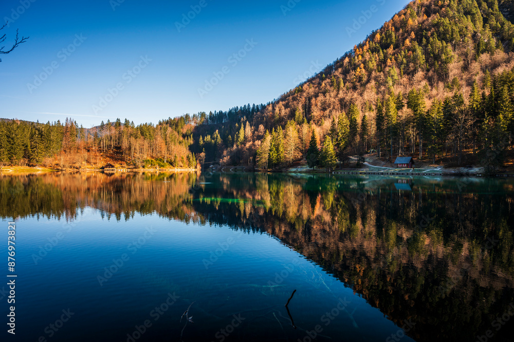 Morning in the Fusine lakes valley. Autumn reflections. Morning in the Fusine lakes valley. Autumn reflections.