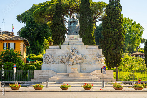 Canvas Print A marble monument to Giuseppe Mazzini, an Italian politician and activist, stands tall in Rome, surrounded by lush greenery