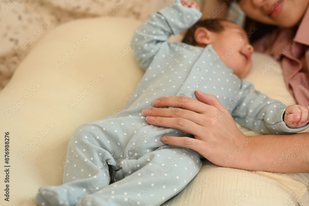 Close up shot of mother hand touching on her little newborn son chest gently. Motherhood and child care concept Close up shot of mother hand touching on her little newborn son chest gently. Motherhood and child care concept