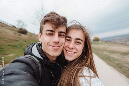 Happy Couple Taking a Selfie Outdoors on a Cloudy Day