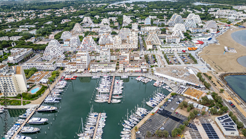 Aerial of the sport harbour, futuristic seaside town of La Grande Motte, Herault, Occitania, France, Europe photo