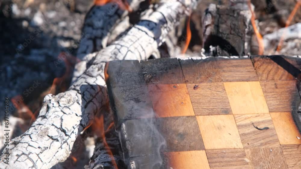 The chessboard is burning in the fire. Burning chessboard. Chessboard on fire The chessboard is burning in the fire. Burning chessboard. Chessboard on fire