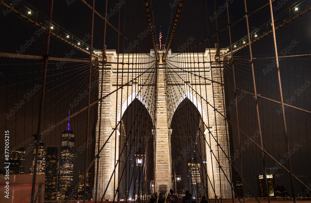 Fototapeta premium Brooklyn suspension bridge view at night with lights - USA tourism them