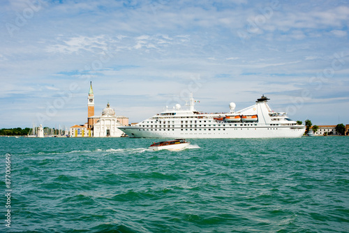 A cruise ship in the lagoon passing in front of San Marco Giardinetti seen from Punta della Dogana, Venice, UNESCO World Heritage Site, Veneto, Italy, Europe