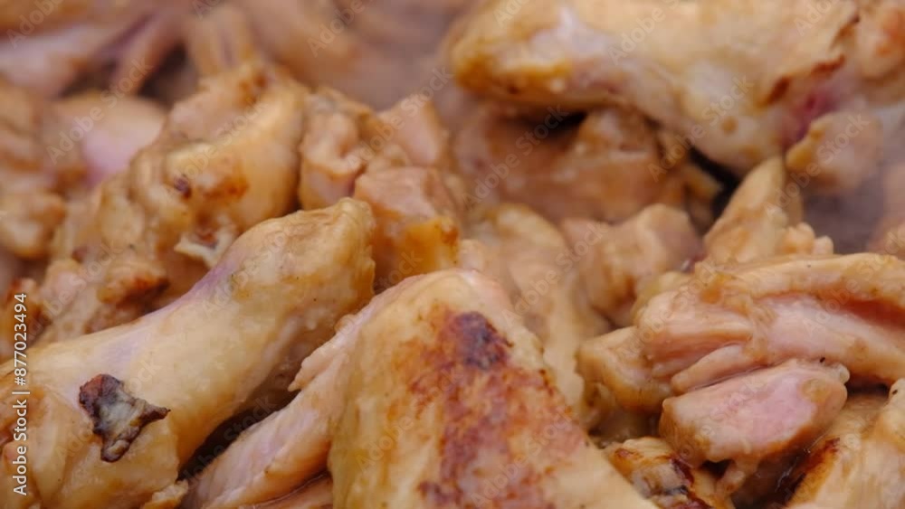 The meat is stewed in a cauldron. Chicken meat is stewed in a cauldron. A dish on a fire in a cauldron. Stewing meat in a cauldron The meat is stewed in a cauldron. Chicken meat is stewed in a cauldron. A dish on a fire in a cauldron. Stewing meat in a cauldron