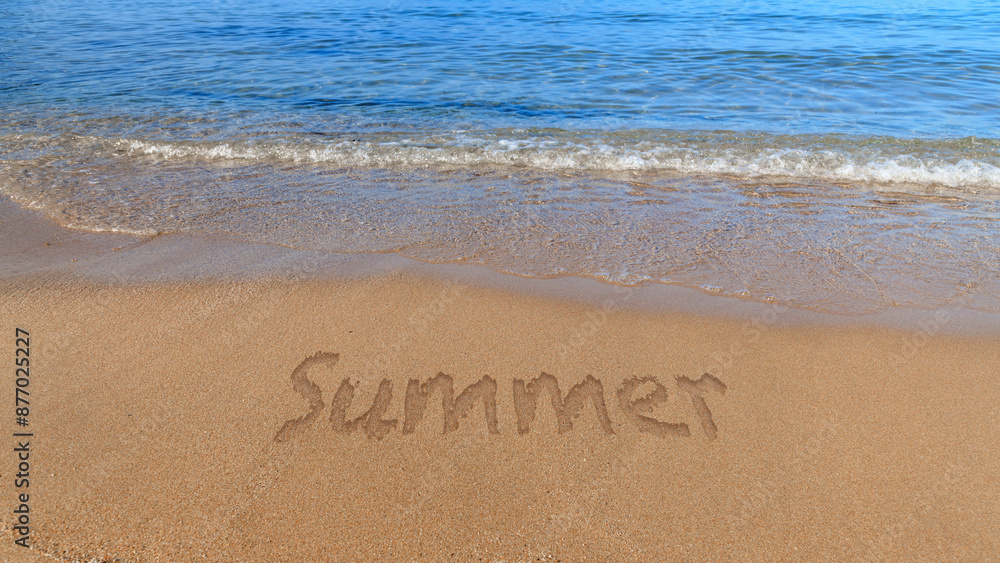 Fototapeta premium Summer word on sandy beach with blue waves of sea or ocean water. Beach background.