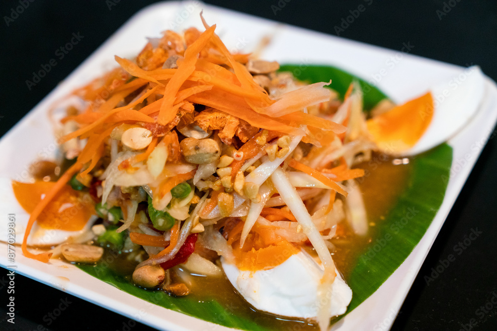 Spicy papaya salad with salted egg, Somtum, Thai food. Spicy papaya salad with salted egg, Somtum, Thai food.