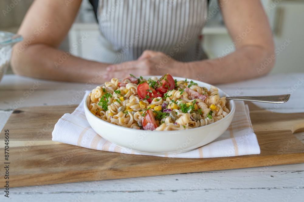 Fresh vegetarian pasta salad with tomatoes, corn, pickles and onions. Delicous homemade summer food Fresh vegetarian pasta salad with tomatoes, corn, pickles and onions. Delicous homemade summer food