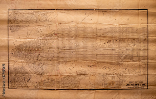 A Vintage historically important map of New York City on grunge paper with black drawing of city streets