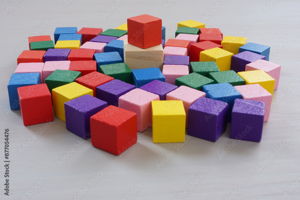 Inclusive leadership. A crowd of multi-colored cubes and one main one. Inclusive leadership. A crowd of multi-colored cubes and one main one.