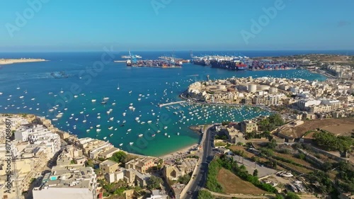 Drone top view of port, city, boats on the see. Freeport, road. Maltese island