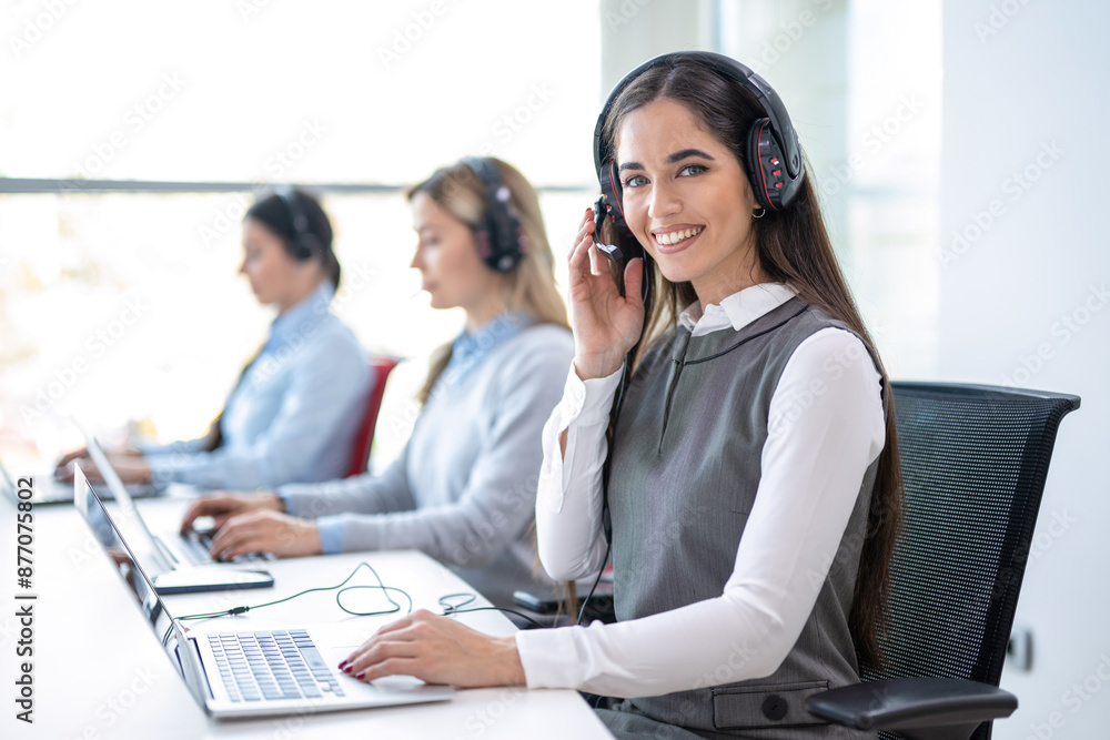 Happy woman in call center consulting, speaking or talking at customer services. Happy woman in call center consulting, speaking or talking at customer services.