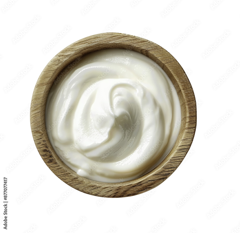 Top view of creamy yogurt in a wooden bowl, isolated on white background. Perfect for food and dairy product advertising. Top view of creamy yogurt in a wooden bowl, isolated on white background. Perfect for food and dairy product advertising.