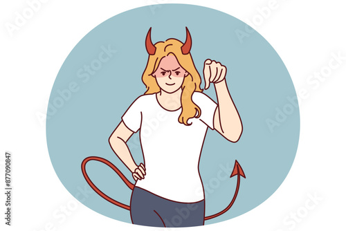 Woman demon with horns and tail points her finger at screen and looks at you aggressively. Evil demon girl threatens or tries to solve problems that have arisen with help of violence and aggression photo