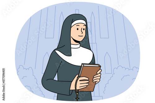Woman nun with bible stands near church calling to visit christian shrines and study gospel or religious prayers. Catholic nun in white and black cassock holds cross for traditional orthodox rituals.