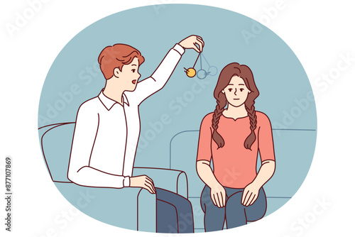 Man psychotherapist hypnotizes woman patient using pendulum to solve psychological problems in subconscious. Guy hypnotizes girl to take advantage unconscious state or remove information from memory