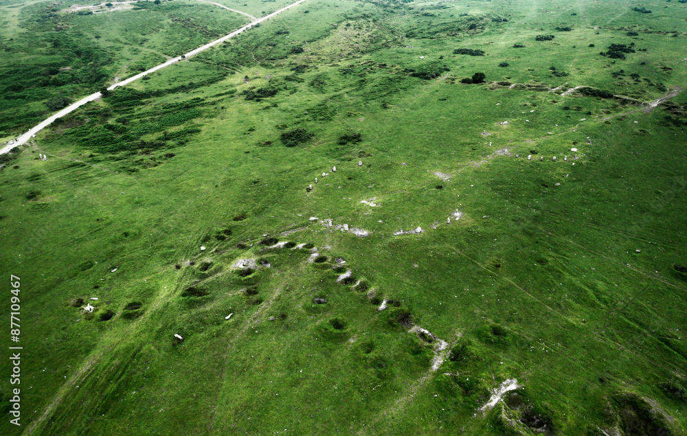 The Hurlers, 3 side by side prehistoric stone circles. S.E. edge of Bodmin Moor at Minions, Cornwall. Also recent shallow shaft copper mine holes