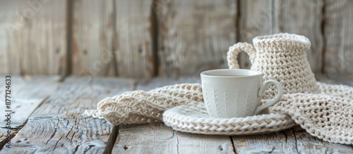 Crocheted cup of coffee and milk jug with copy space image. photo