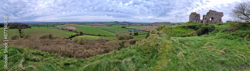 A panoramic view of the Rock of Dunamase and the surrounding Irish landscape, capturing the majestic ruins and the natural beauty of the region. photo