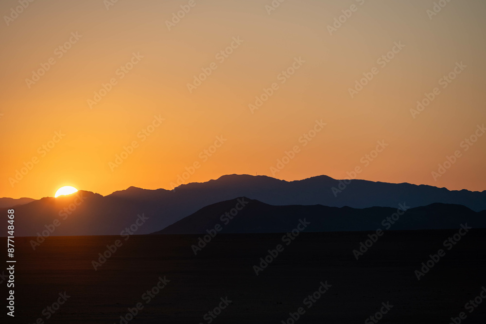 sunrise over the mountains and sand dunes of sossusvlei, namibia sunrise over the mountains and sand dunes of sossusvlei, namibia