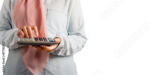 muslim woman with casual attire holding a calculator, business woman concept mock up with a copy space, isolated on white background  photo