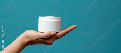 A woman s hand holds a cosm...