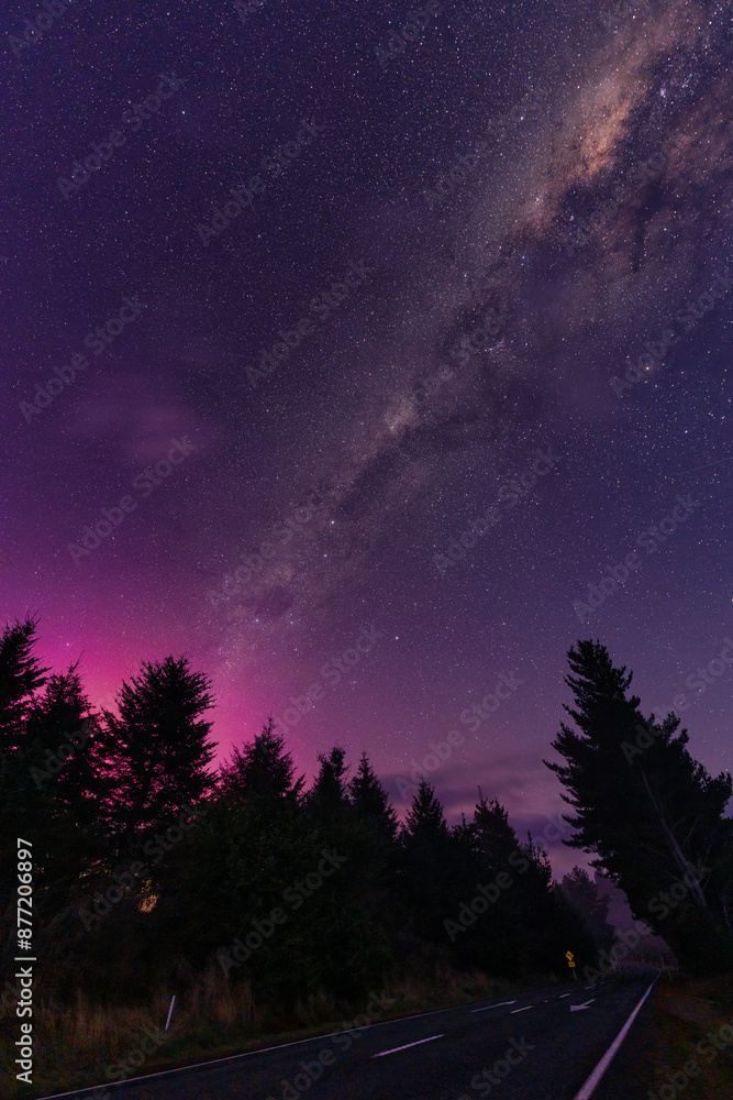 Milky way and Aurora australis over the forest on the road in rural scene at New Zealand Milky way and Aurora australis over the forest on the road in rural scene at New Zealand