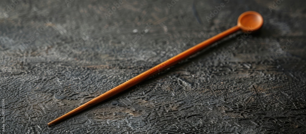 Japanese made wooden earpick displayed with copy space image Japanese made wooden earpick displayed with copy space image