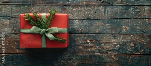 A solitary red gift box wit...