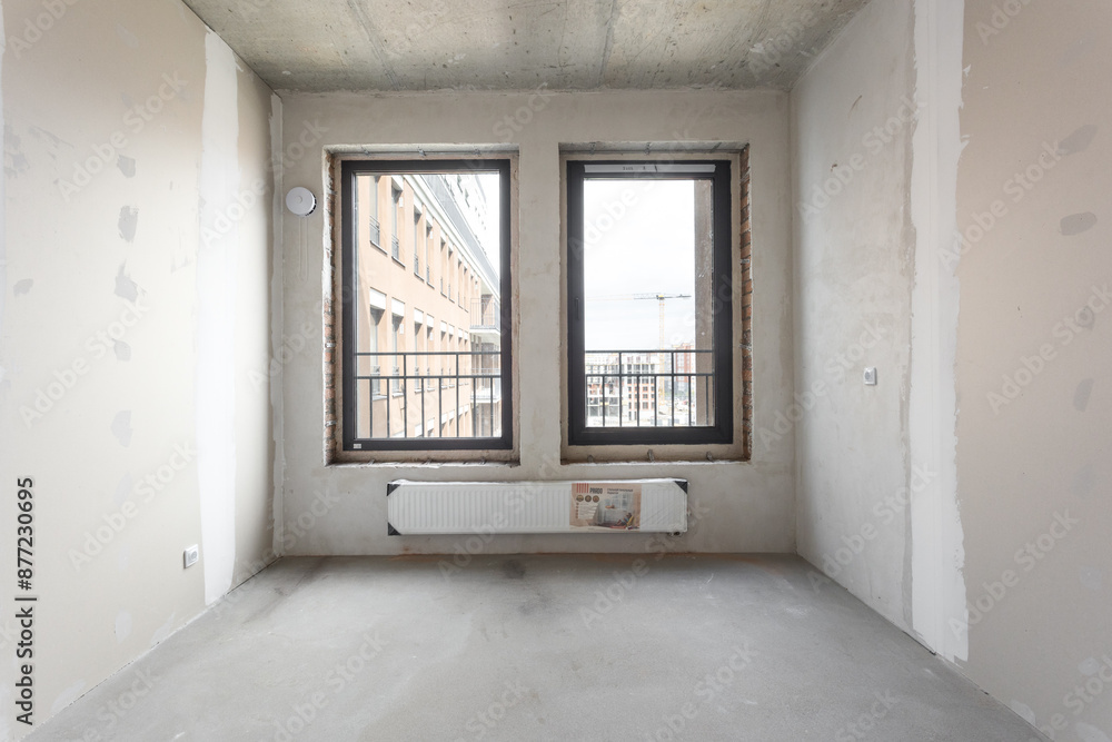 interior of the apartment without decoration in gray colors. rough finish interior of the apartment without decoration in gray colors. rough finish
