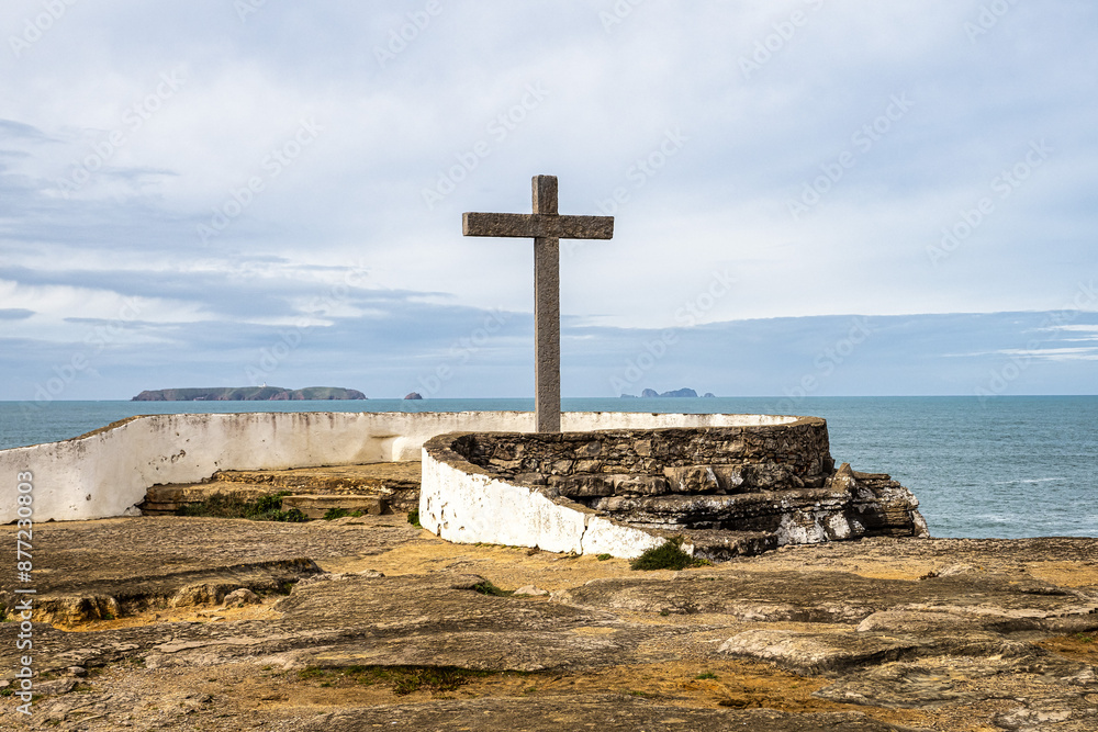 Cross on the coast of the Atlantic Ocean at Cruz dos Remedios, Peniche peninsula, Portugal Cross on the coast of the Atlantic Ocean at Cruz dos Remedios, Peniche peninsula, Portugal