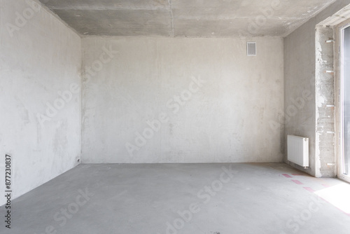 interior of the apartment without decoration in gray colors. rough finish