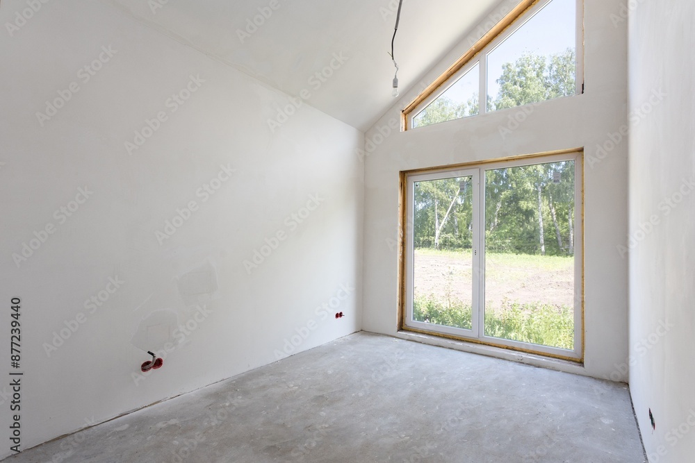 Fototapeta premium interior of the apartment without decoration in gray colors. rough finish