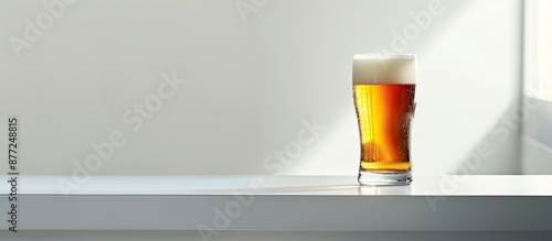 A glass of beer resting on ...