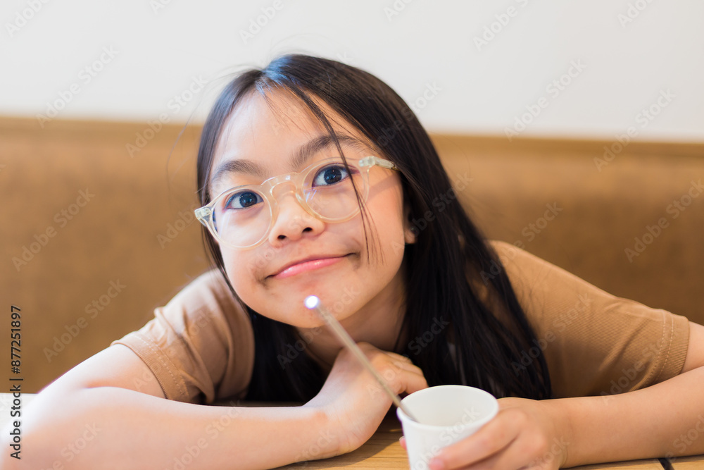 couple family came together in a cafe. Happy little daughter eat cakes and ice cream. They are happy together. Happy family lunch concept. couple family came together in a cafe. Happy little daughter eat cakes and ice cream. They are happy together. Happy family lunch concept.