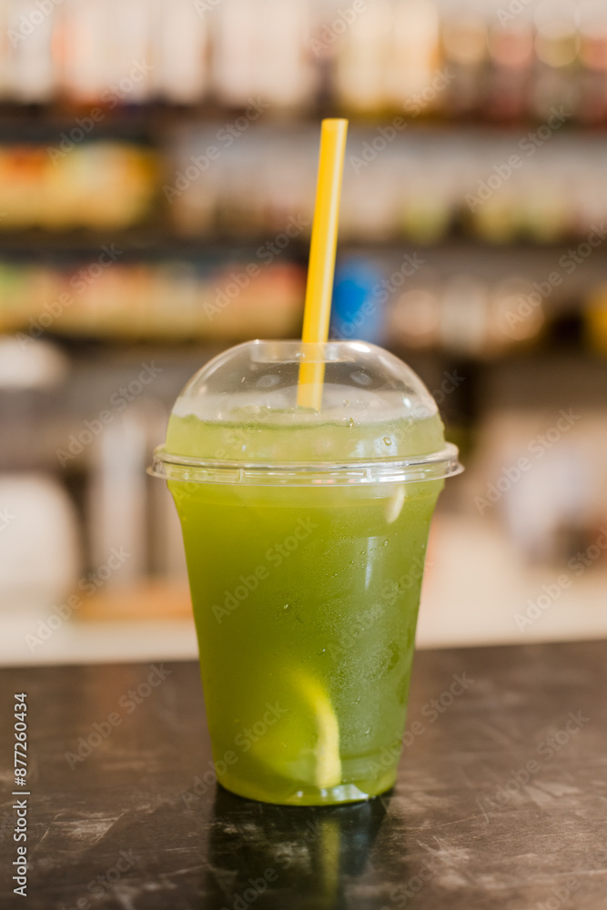 green cocktail with ice on the table. nonalcoholic drink green cocktail with ice on the table. nonalcoholic drink